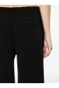 black-ribbed-knit-trousers