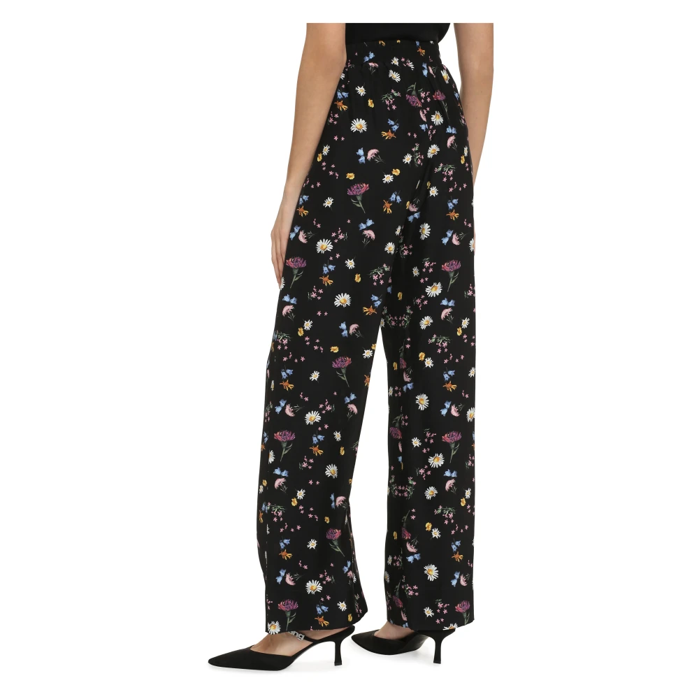 Stella Mccartney Zijden broek met bloemenprint Black Dames