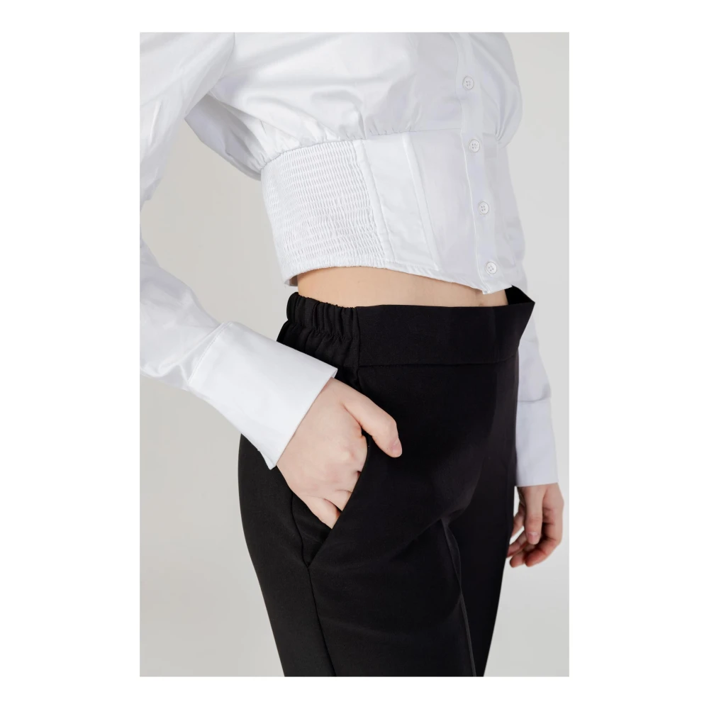 Sandro Ferrone Zwarte elastische broek met zijzakken Black Dames
