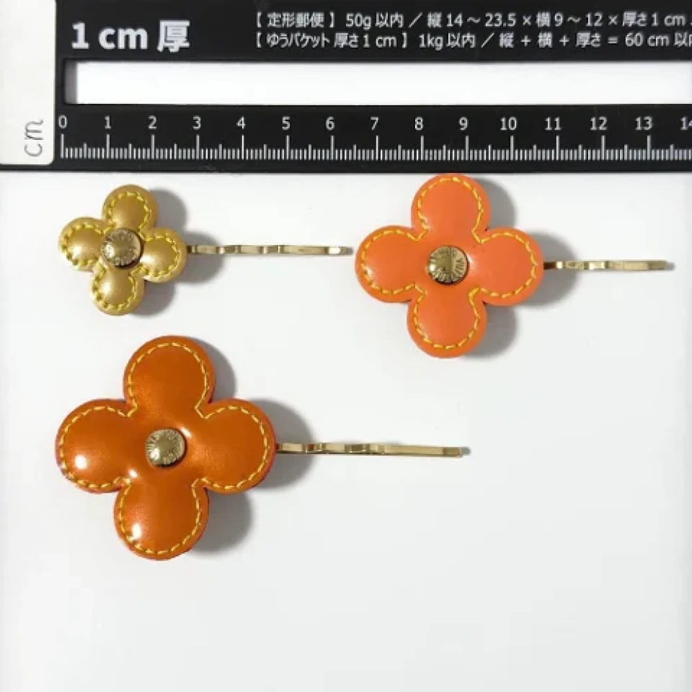 Louis Vuitton Vintage Pre-owned Leather hair-accessories Orange Dames