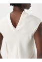 haut-elegant-sans-manches-a-volants-jaune