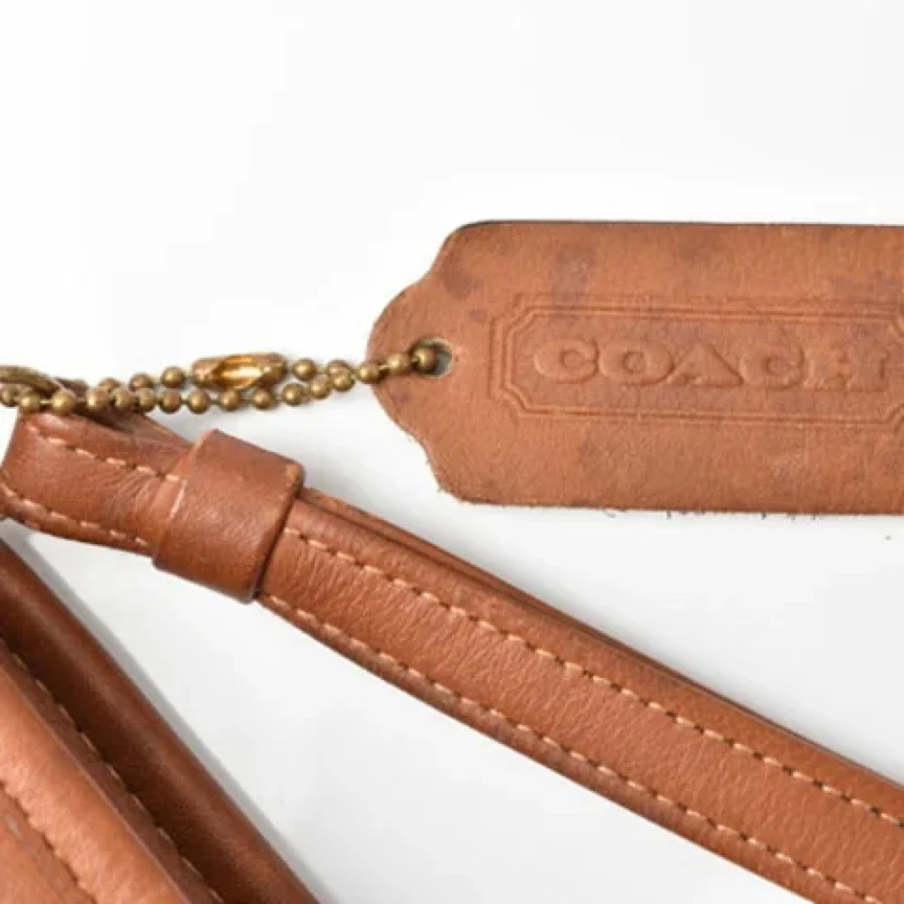 Coach Pre-owned Leather clutches Brown Dames