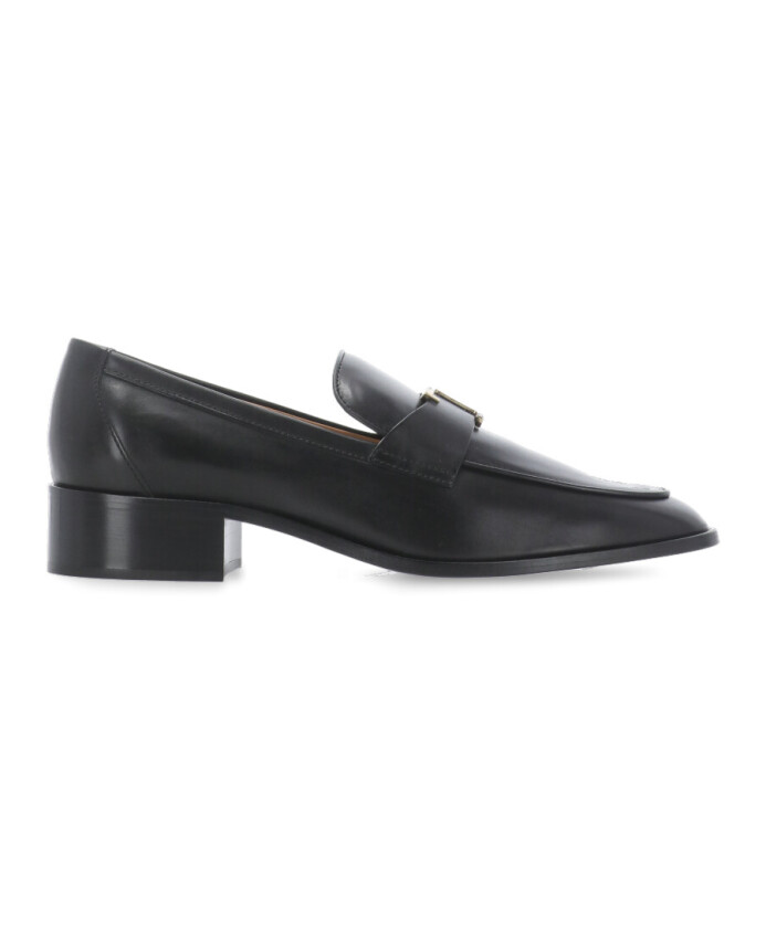 black-leather-loafers-with-metal-logo