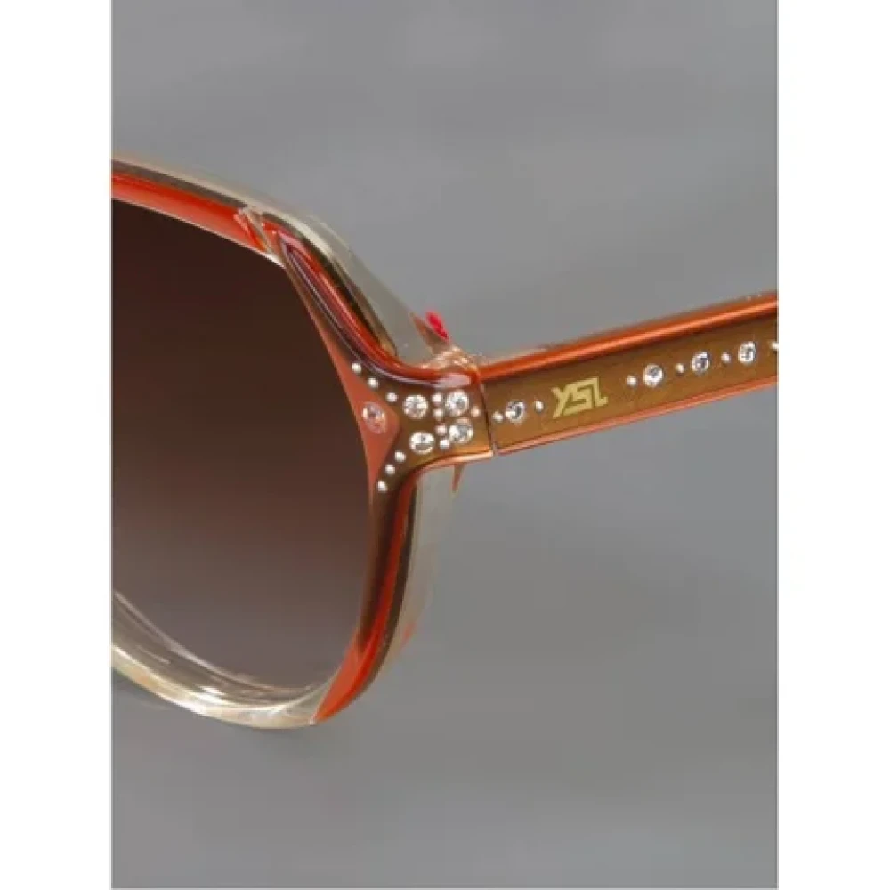 Yves Saint Laurent Vintage Pre-owned Acetate sunglasses Orange Dames