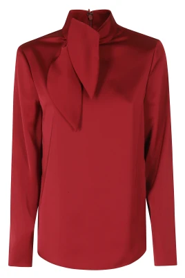 Blus med satinblomma