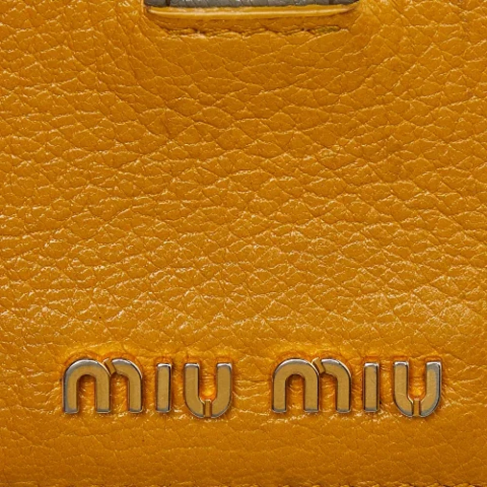 Miu Pre-owned Leather wallets Yellow Dames