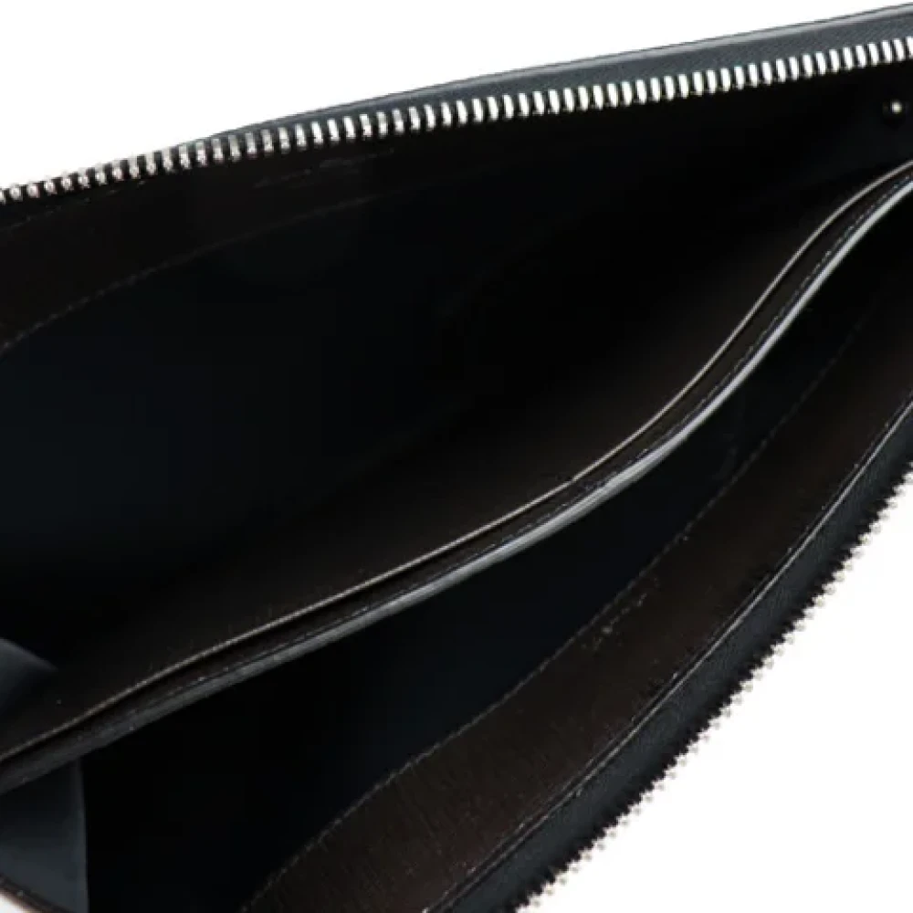 Salvatore Ferragamo Pre-owned Leather clutches Gray Dames