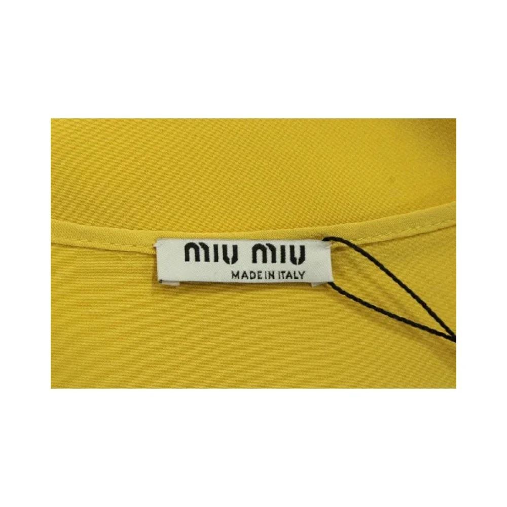 Miu Pre-owned Silk tops Yellow Dames