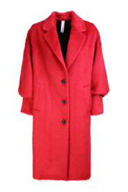 Santa Caterina coat by HevÃ². The brand evokes the history of Italian fashion with original and contemporary touches