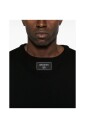 pull-en-maille-noir-avec-patch-logo