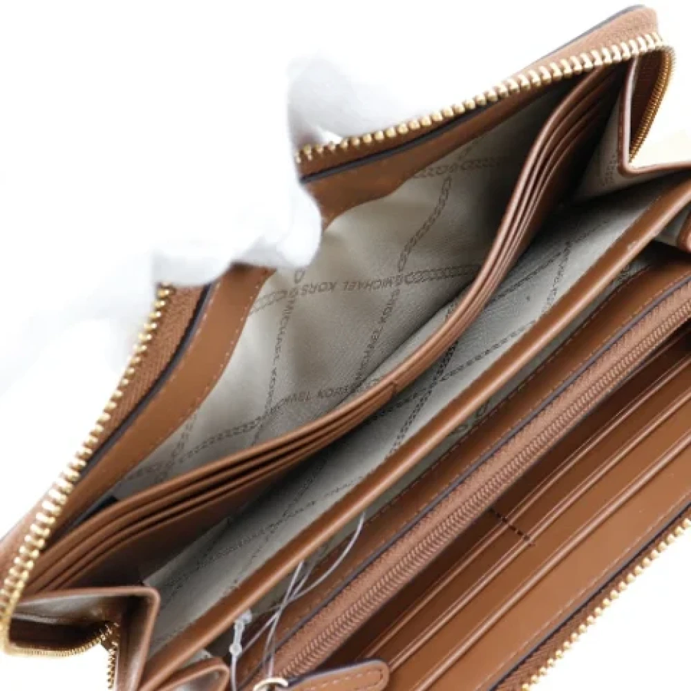 Michael Kors Pre-owned Leather wallets Brown Dames