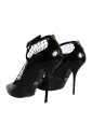 talons-en-cuir-noir-avec-fermeture-a-boucle