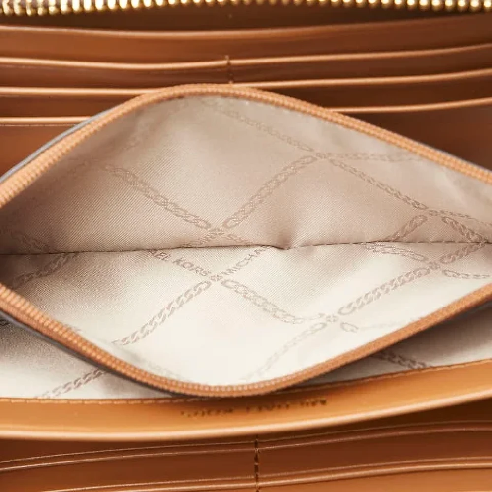Michael Kors Pre-owned Canvas wallets Brown Dames