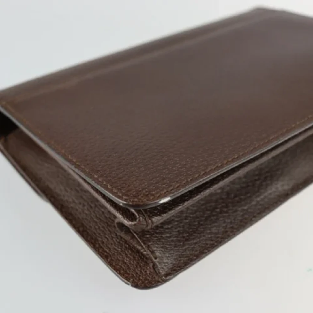 Salvatore Ferragamo Pre-owned Leather clutches Brown Unisex