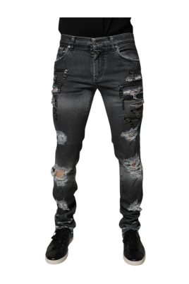 Jeans med dragkedjedetaljer och slitningar