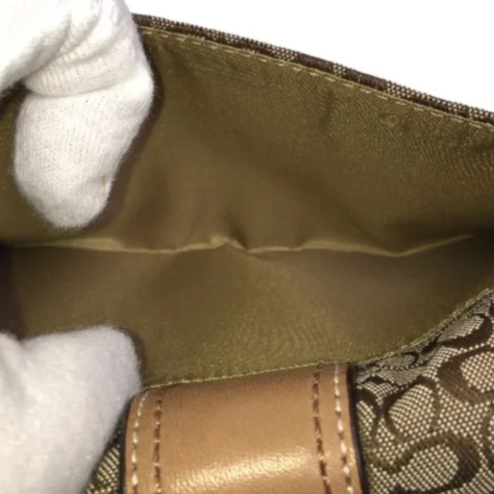 Coach Pre-owned Fabric clutches Brown Dames