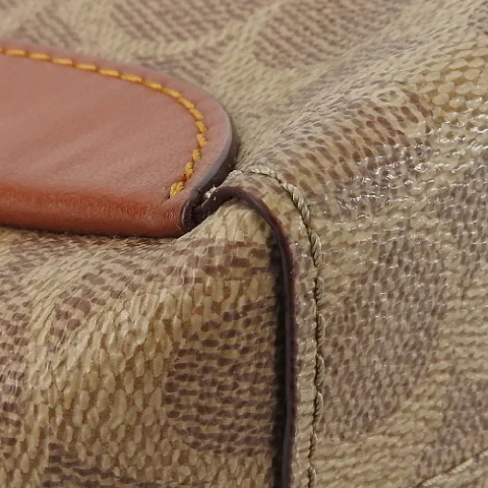 Coach Pre-owned Plastic handbags Brown Dames