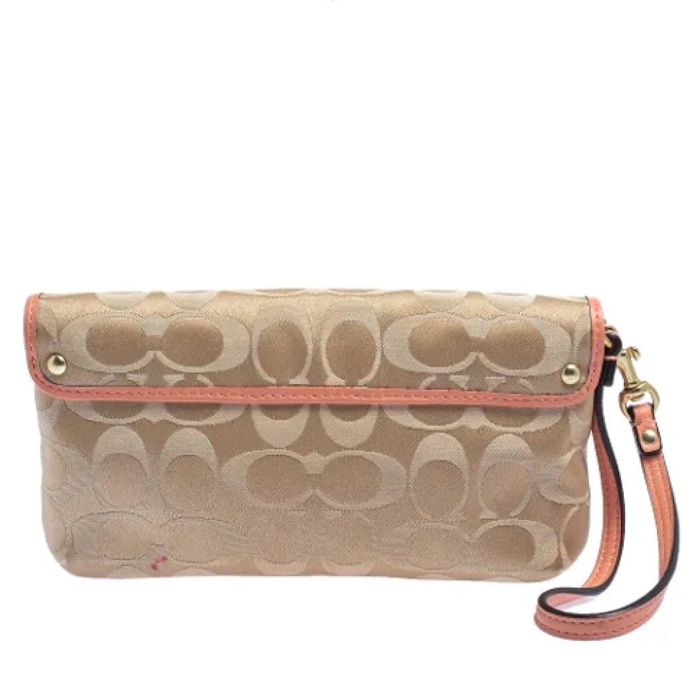 Coach Pre-owned Canvas clutches Beige Dames
