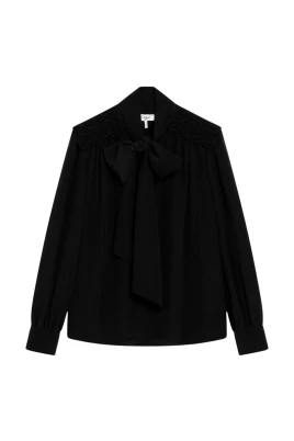 Blus med rosettdetaljer i spets