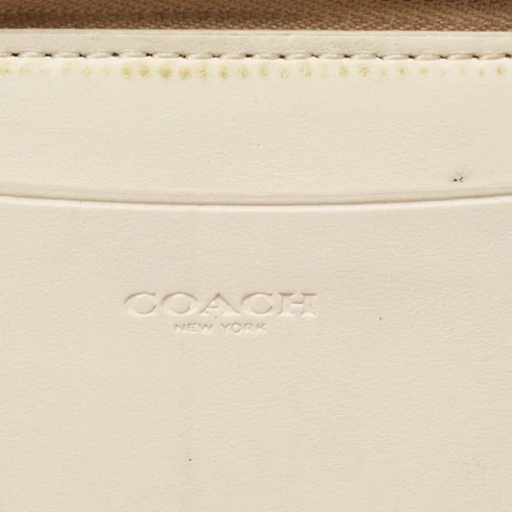 Coach Pre-owned Coated canvas wallets Beige Dames
