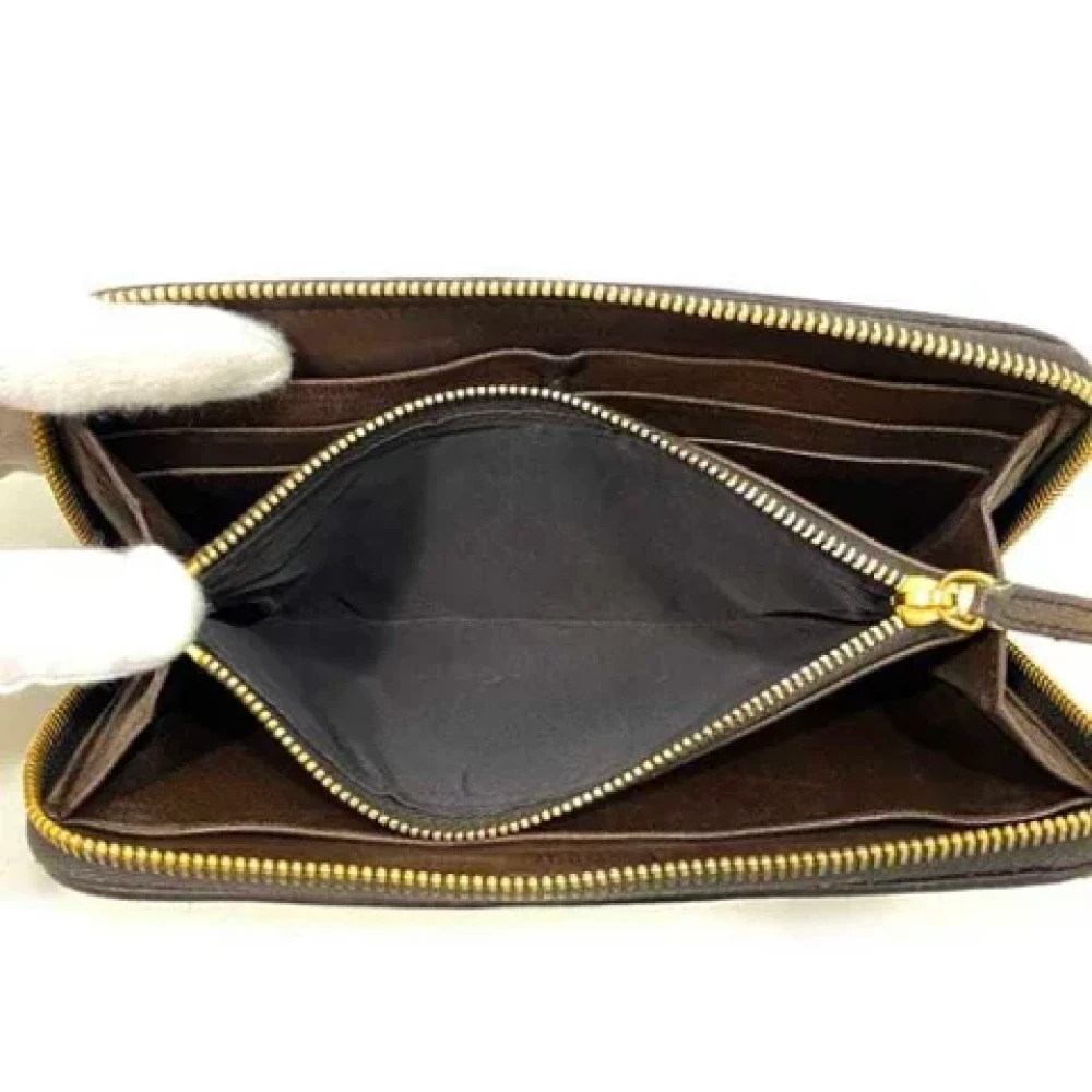 Miu Pre-owned Leather wallets Brown Dames