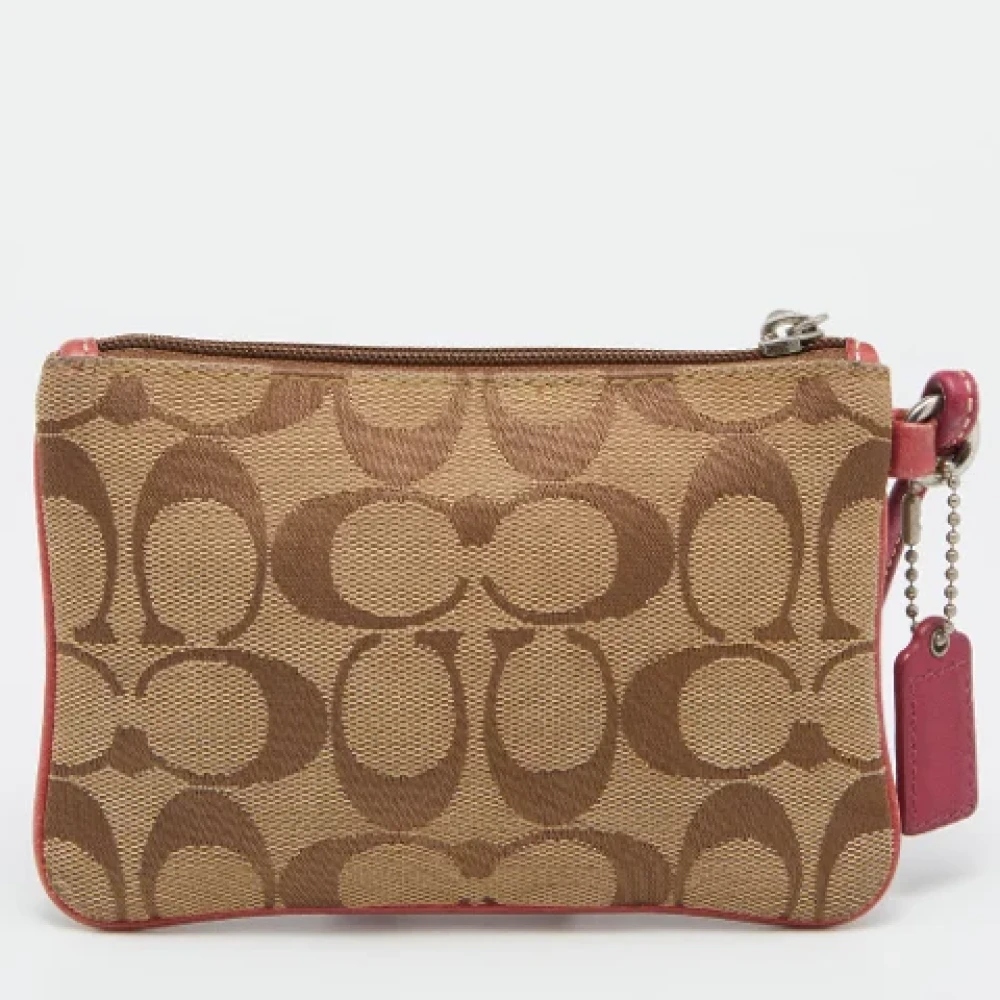 Coach Pre-owned Canvas clutches Beige Dames