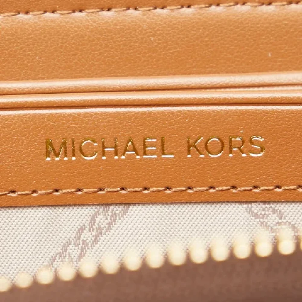 Michael Kors Pre-owned Canvas wallets Brown Dames