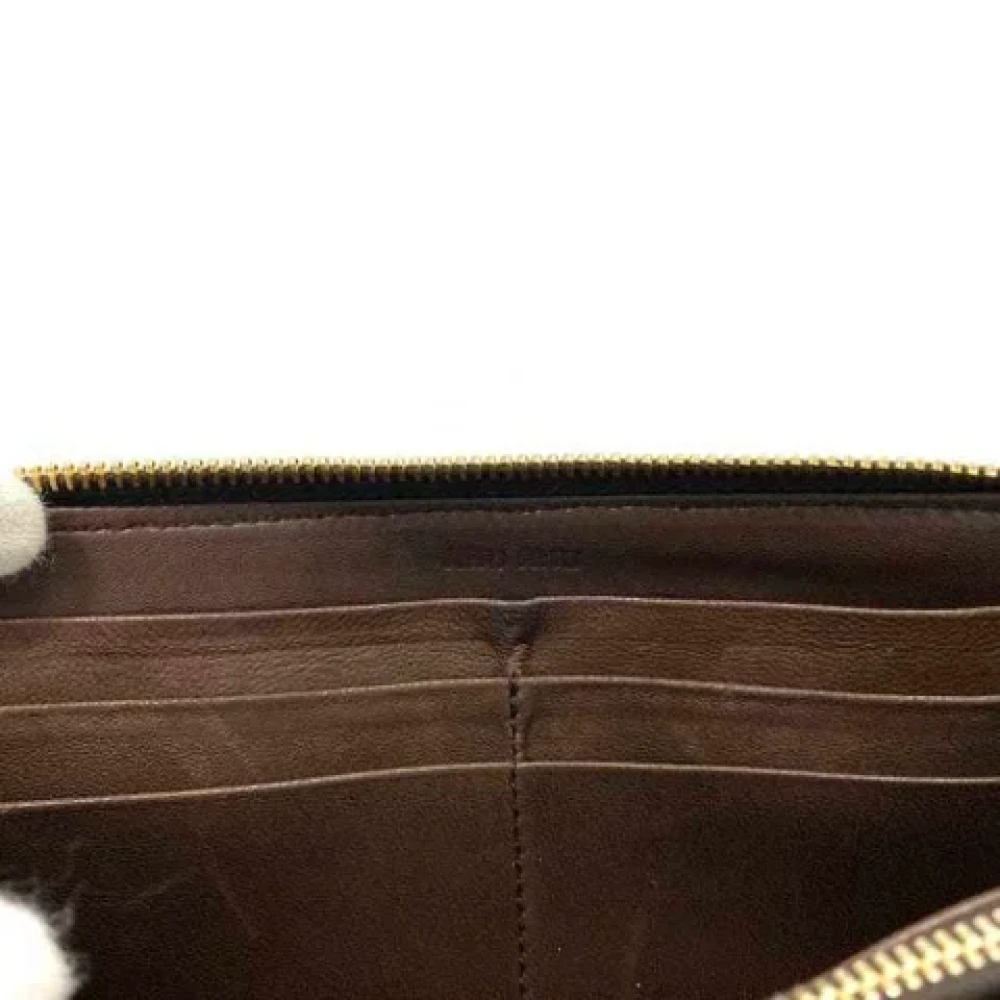 Miu Pre-owned Leather wallets Brown Dames