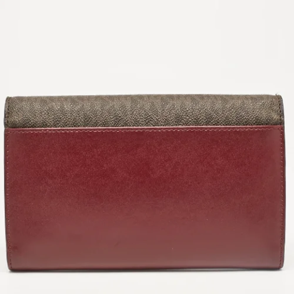 Michael Kors Pre-owned Canvas clutches Red Dames