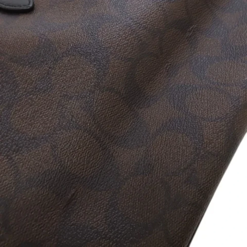 Coach Pre-owned Plastic handbags Brown Dames