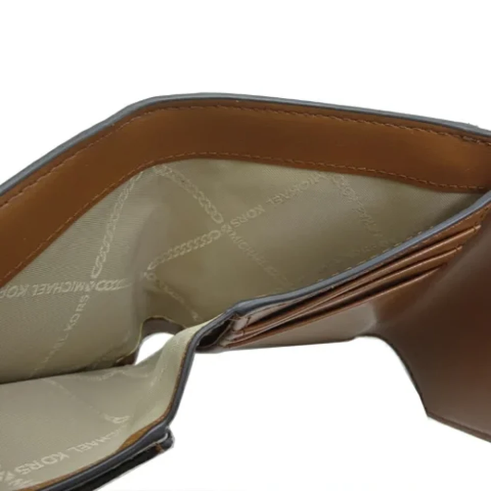 Michael Kors Pre-owned Canvas wallets Brown Dames