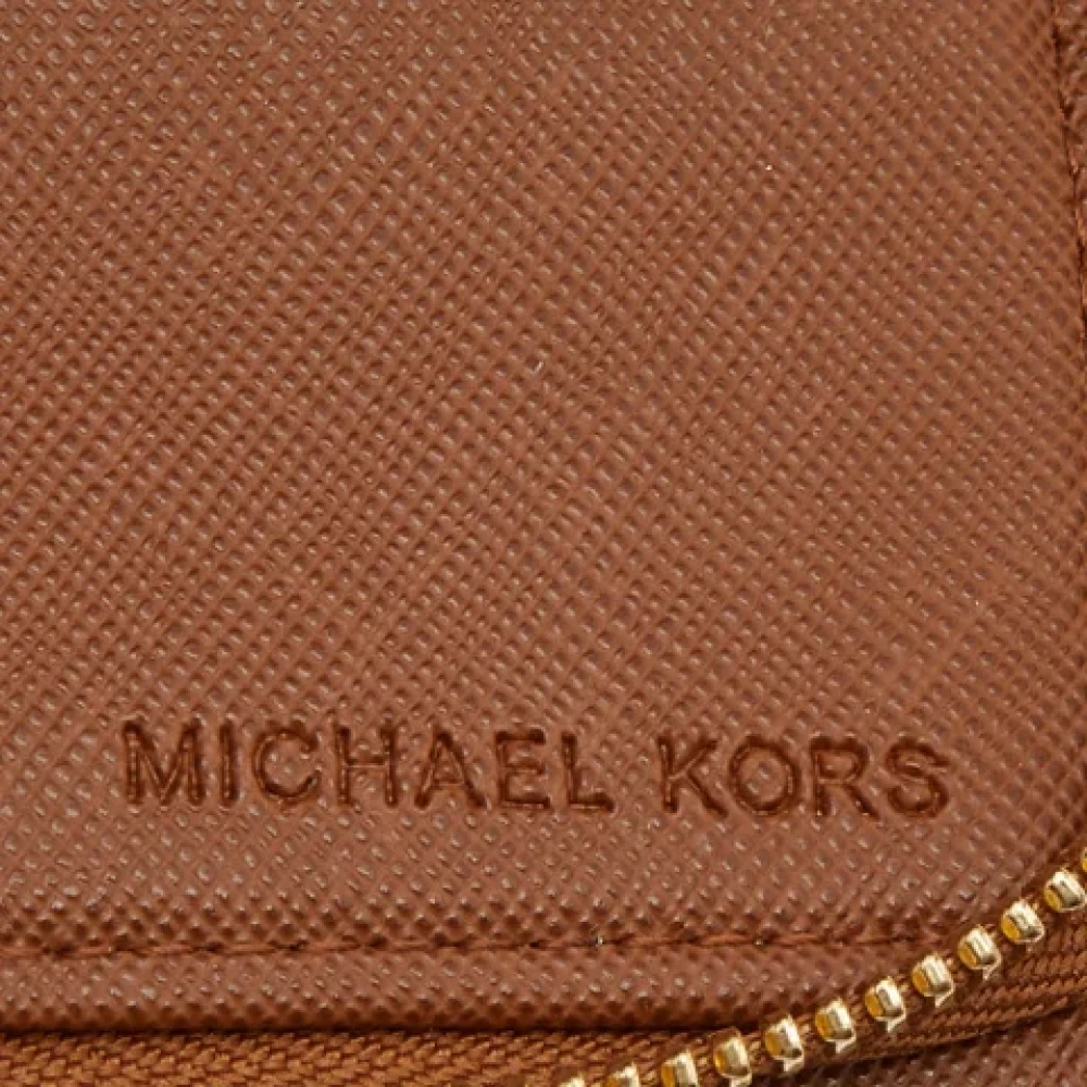 Michael Kors Pre-owned Coated canvas wallets Brown Dames