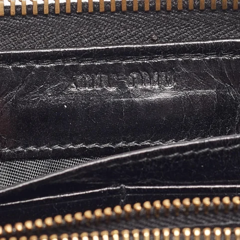 Miu Pre-owned Leather wallets Black Dames