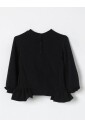 haut-en-tricot-brillant-avec-manches-a-volants