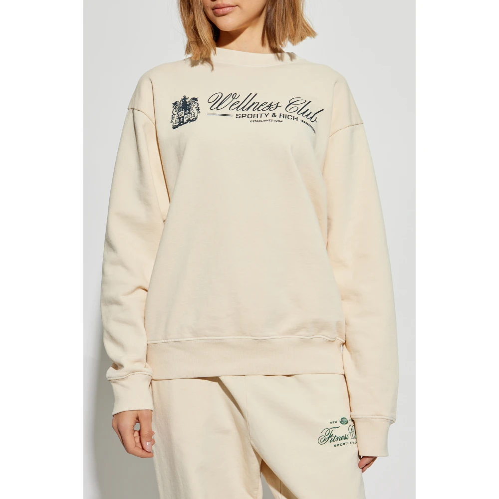 Sporty & Rich Sweatshirt uit de Wellness Club collectie Beige Unisex
