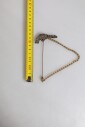 broche-revolver-noir-et-or