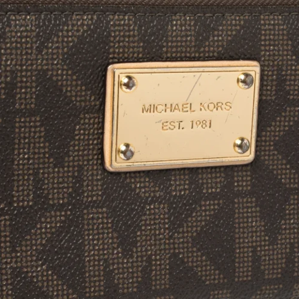 Michael Kors Pre-owned Coated canvas wallets Brown Dames