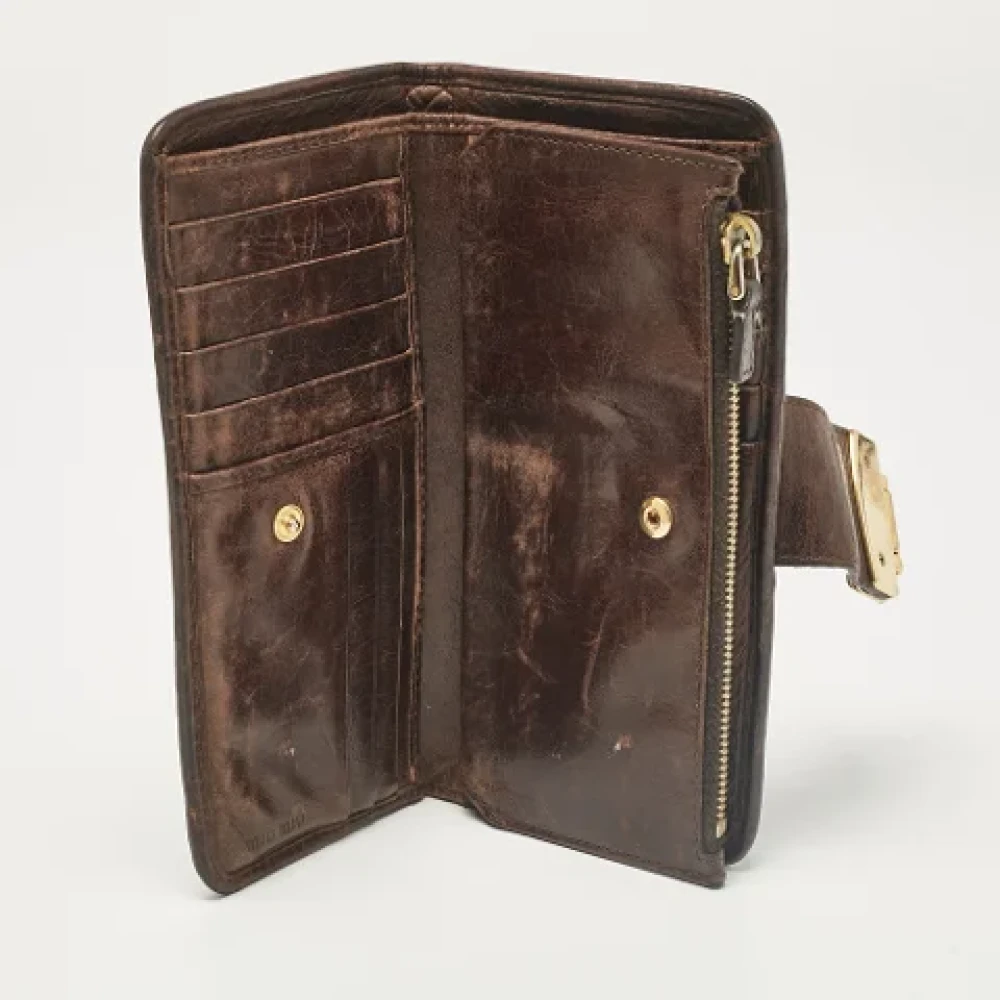 Miu Pre-owned Leather wallets Brown Dames