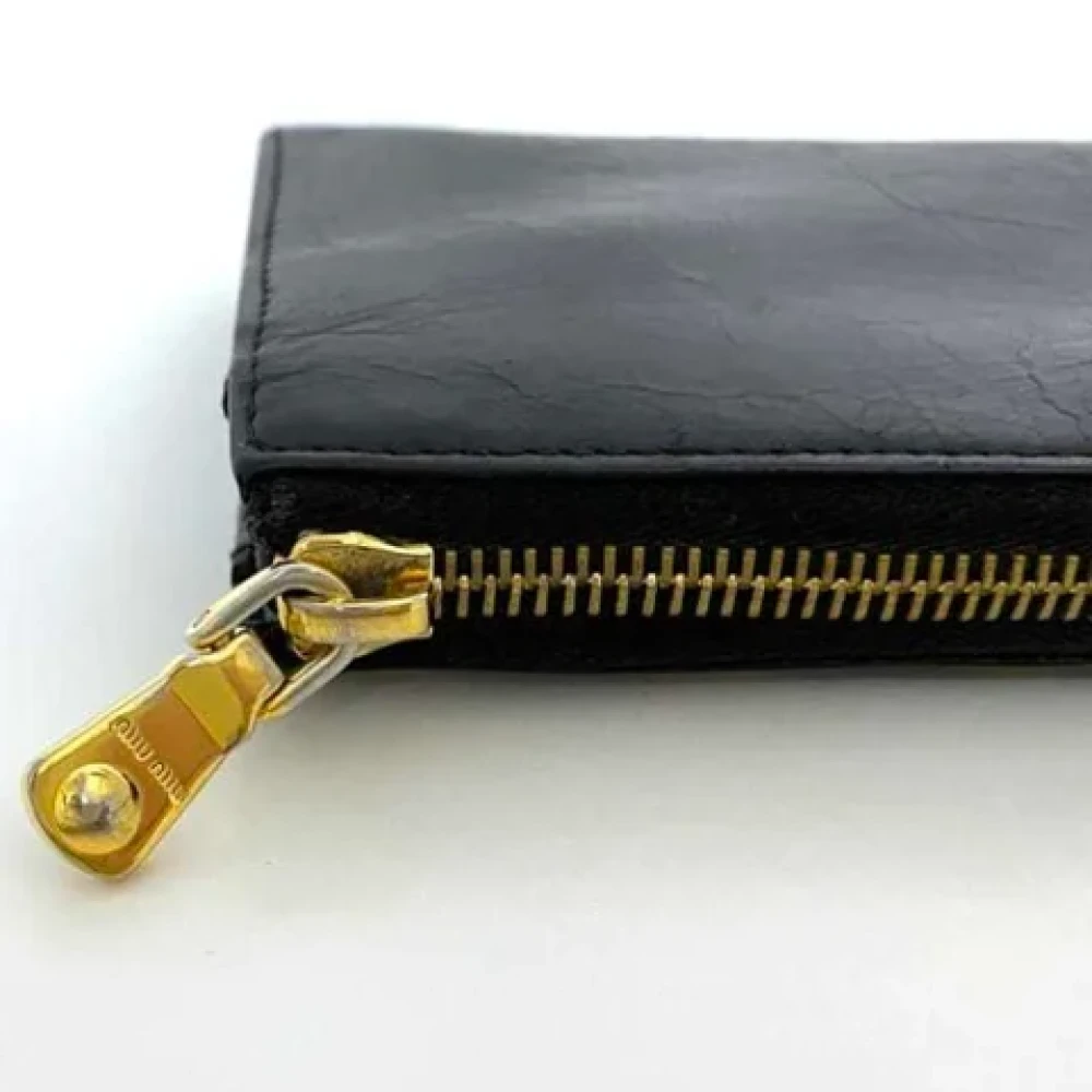 Miu Pre-owned Leather wallets Black Dames