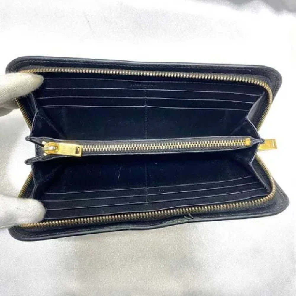 Yves Saint Laurent Vintage Pre-owned Leather wallets Black Dames
