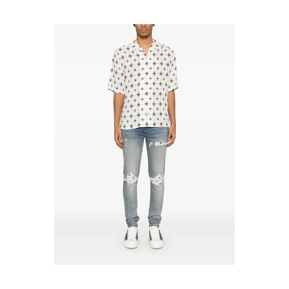 Amiri Lichtblauwe Ripped Jeans met knoopsluiting Blue Heren