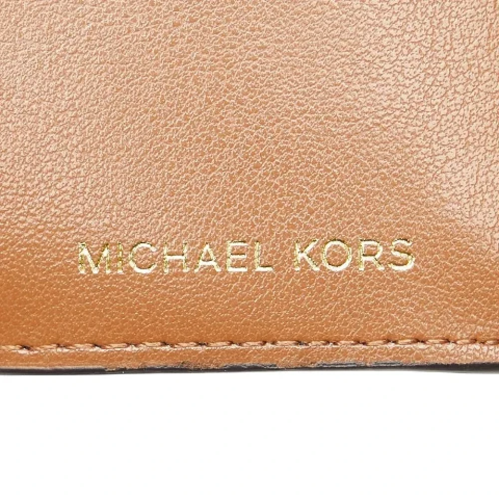 Michael Kors Pre-owned Canvas wallets Brown Dames