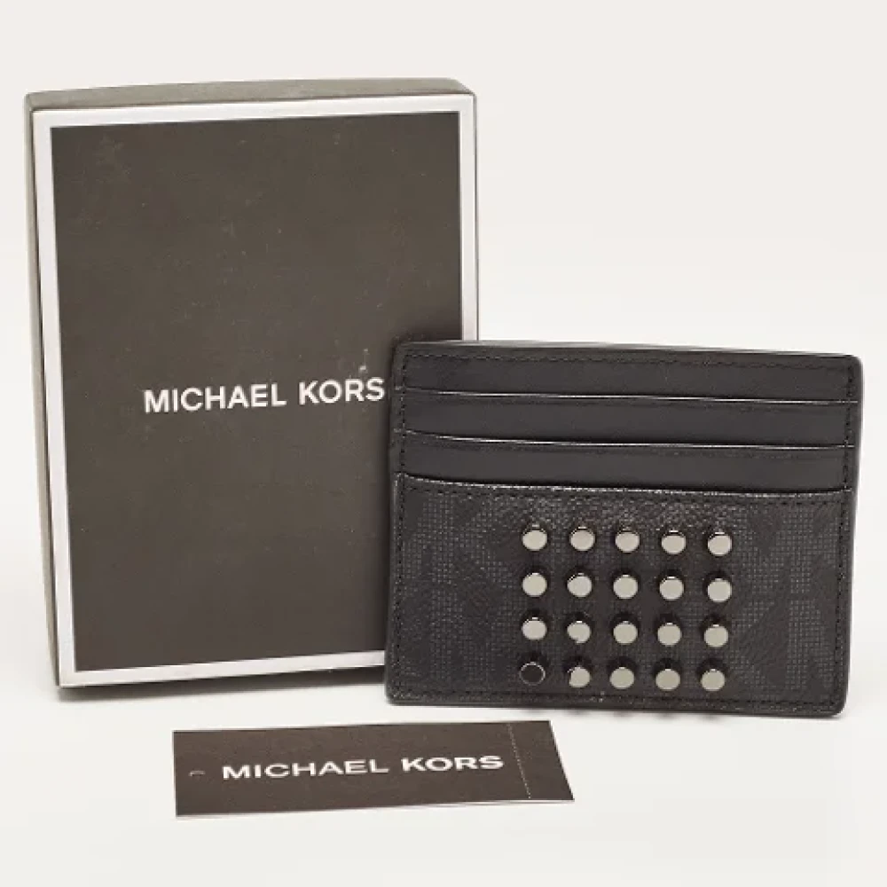 Michael Kors Pre-owned Coated canvas wallets Black Dames