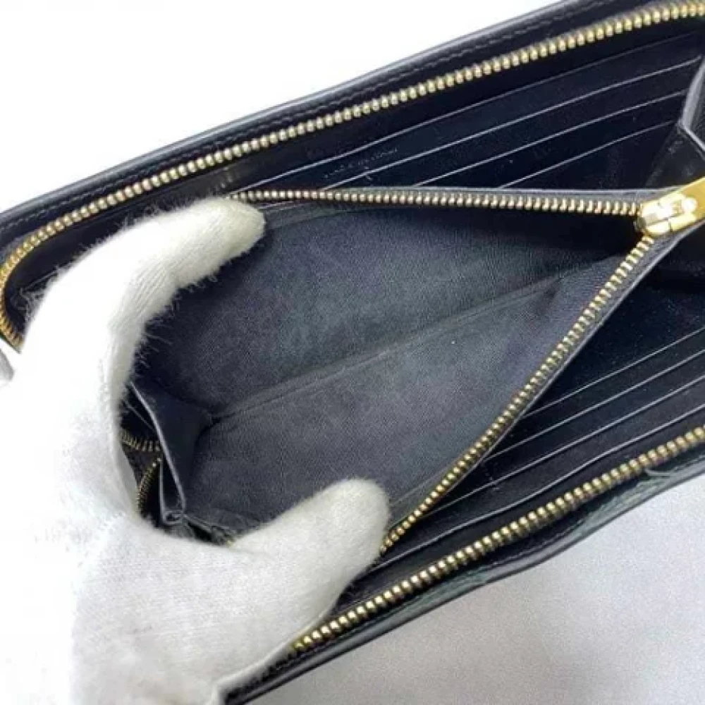 Yves Saint Laurent Vintage Pre-owned Leather wallets Black Dames