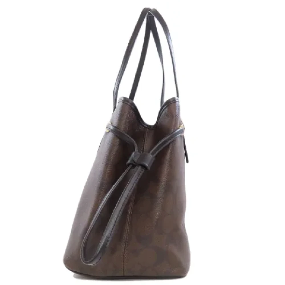 Coach Pre-owned Plastic handbags Brown Dames
