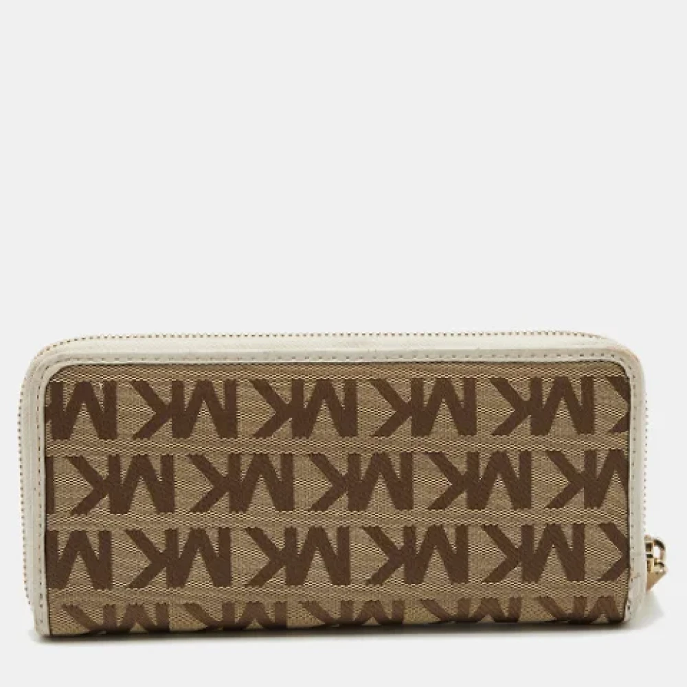 Michael Kors Pre-owned Canvas wallets Beige Dames