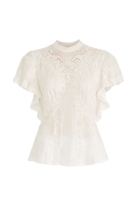 Blus med applikationer