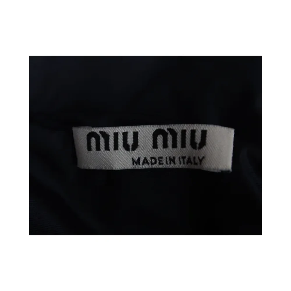 Miu Pre-owned Nylon outerwear Blue Dames