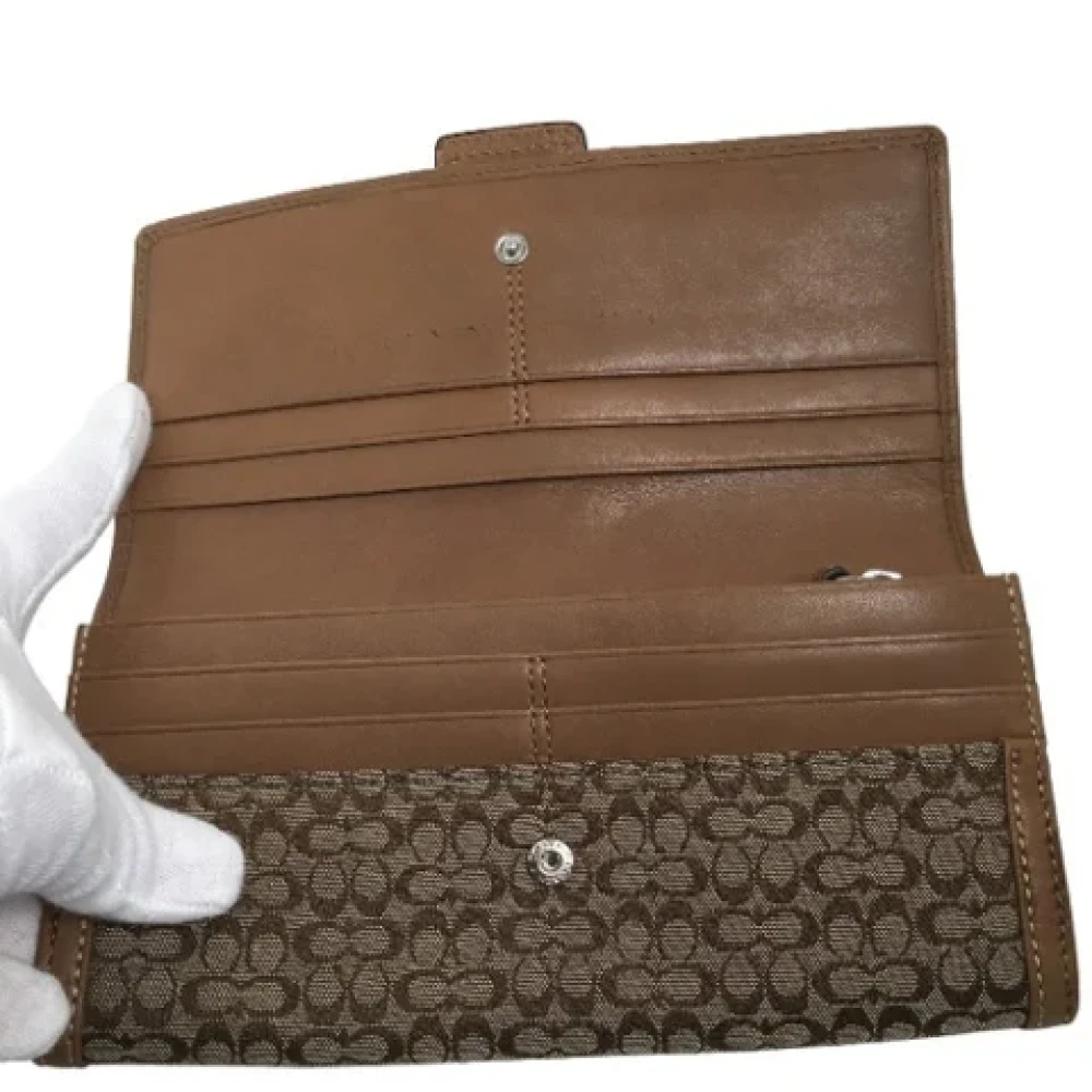 Coach Pre-owned Fabric clutches Brown Dames