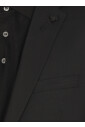 black-wool-suit-with-iconic-pin